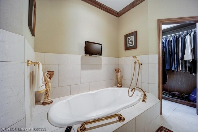 bathroom featuring a relaxing tiled tub, tile patterned floors, and crown molding