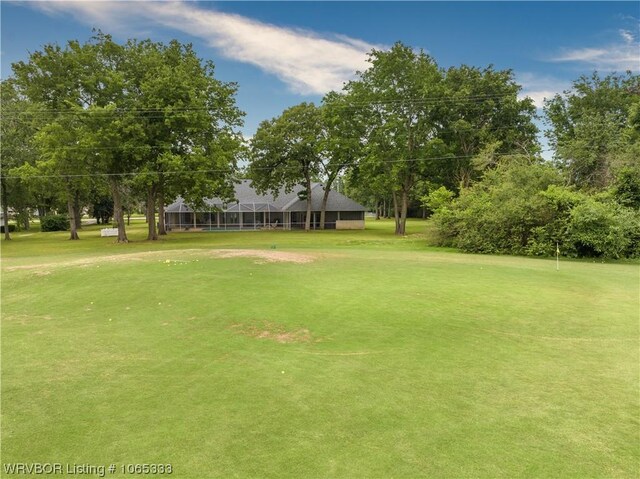 view of property's community with a lawn