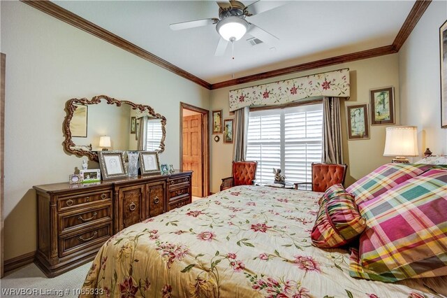 carpeted bedroom with ceiling fan and crown molding