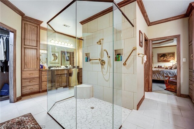 bathroom with tile patterned flooring, vanity, walk in shower, and crown molding