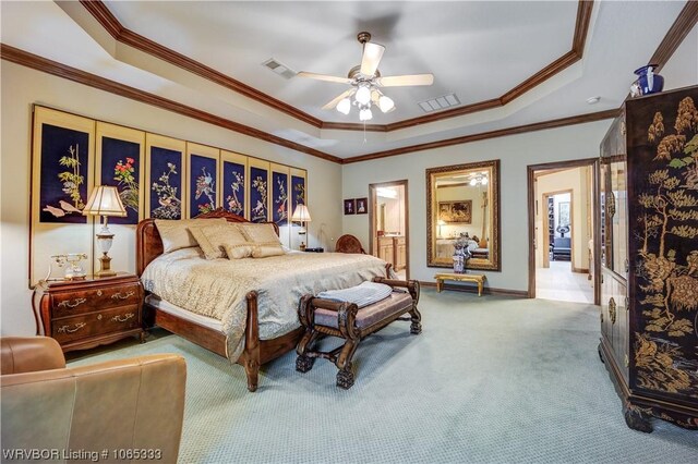 bedroom featuring carpet flooring, a raised ceiling, ceiling fan, and crown molding