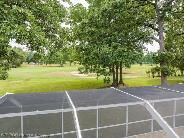 view of vehicle parking featuring a yard