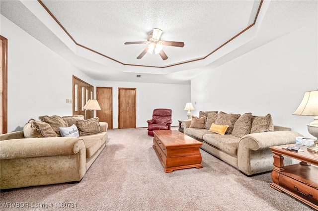 3009 Shadow Lake Dr, Greenwood, AR 72936 - living area featuring a tray ceiling, carpet floors, a ceiling fan, and a textured ceiling