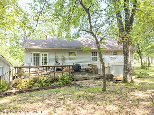 3009 Shadow Lake Dr, Greenwood, AR 72936 - back of house with an exterior structure, an outbuilding, and a deck