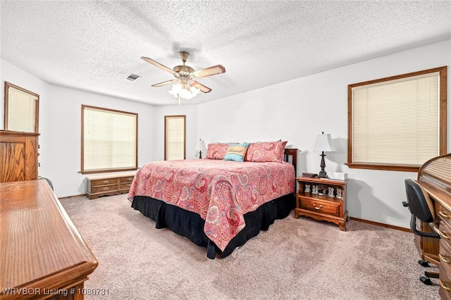 3009 Shadow Lake Dr, Greenwood, AR 72936 - bedroom featuring a textured ceiling, carpet, a ceiling fan, baseboards, and visible vents