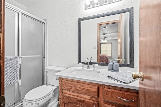 3009 Shadow Lake Dr, Greenwood, AR 72936 - bathroom featuring vanity, toilet, a textured ceiling, connected bathroom, and a shower with shower door