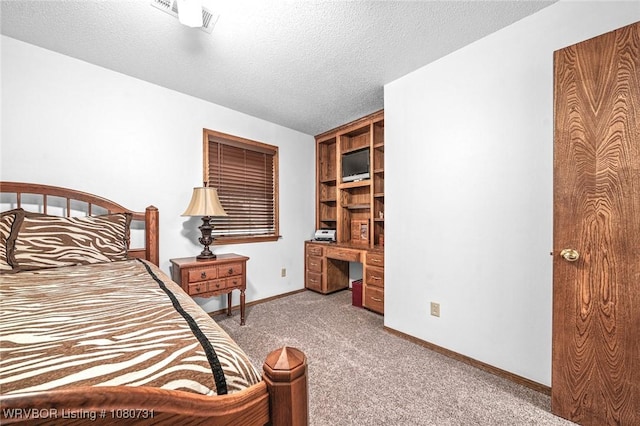 3009 Shadow Lake Dr, Greenwood, AR 72936 - bedroom with carpet floors, visible vents, baseboards, a textured ceiling, and built in desk