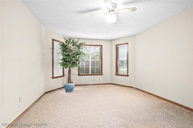 3009 Shadow Lake Dr, Greenwood, AR 72936 - spare room with baseboards, carpet flooring, a textured ceiling, and a ceiling fan