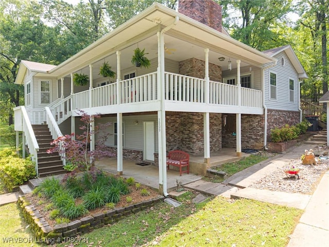 3009 Shadow Lake Dr, Greenwood, AR 72936 - view of front of house with brick siding, a chimney, stairs, and a patio area