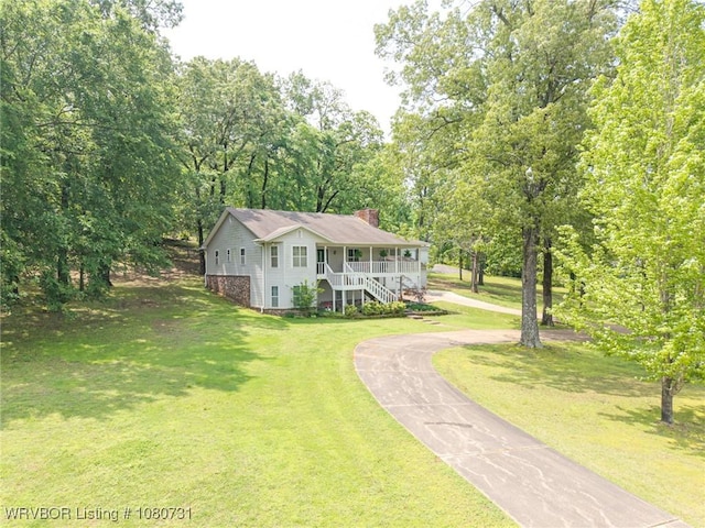 3009 Shadow Lake Dr, Greenwood, AR 72936 - bi-level home with covered porch, driveway, a chimney, a front lawn, and stairs