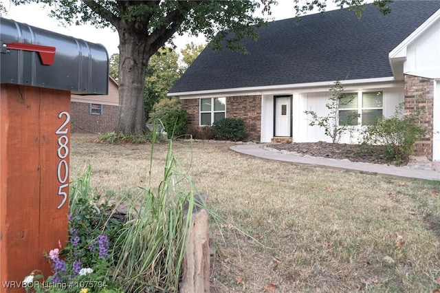 exterior space with a front yard