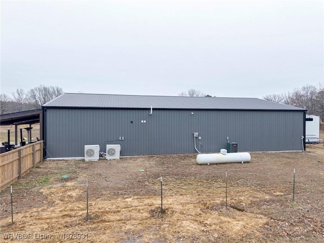 exterior space with ac unit and an outdoor structure