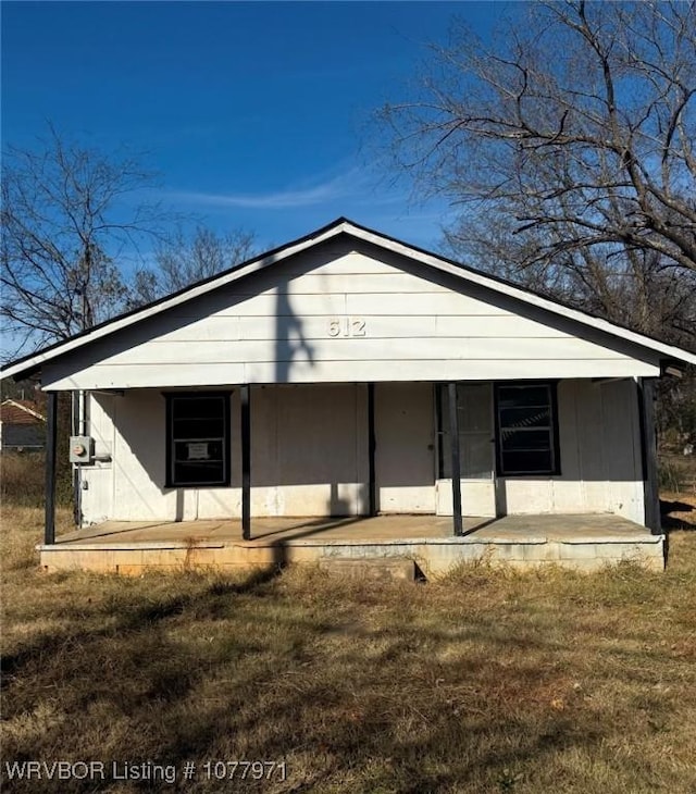 view of front of house with a front lawn and a porch