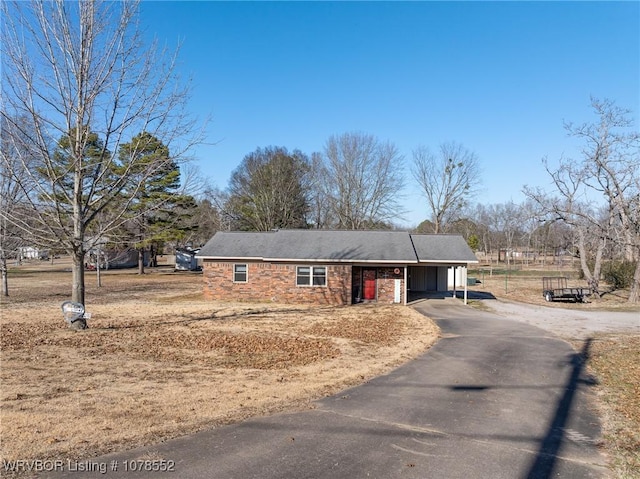 view of front of property with a carport