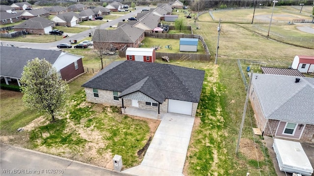 birds eye view of property with a residential view