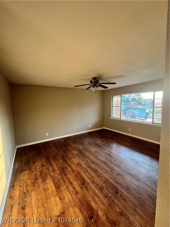 unfurnished room with ceiling fan and hardwood / wood-style floors