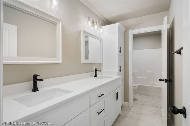 full bathroom featuring vanity, toilet, and bathing tub / shower combination