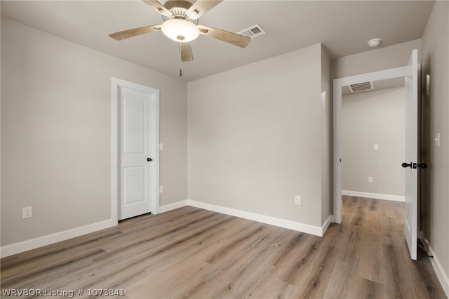 unfurnished bedroom with a closet, light hardwood / wood-style floors, and ceiling fan