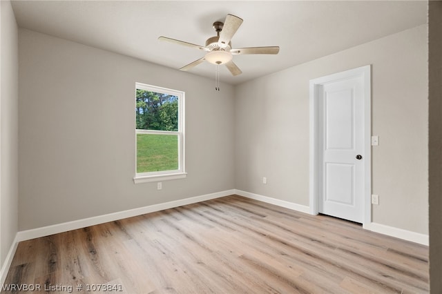 empty room featuring light hardwood / wood-style flooring and ceiling fan