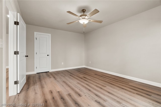 unfurnished room featuring ceiling fan and light hardwood / wood-style floors