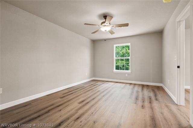 unfurnished room featuring ceiling fan and light hardwood / wood-style floors