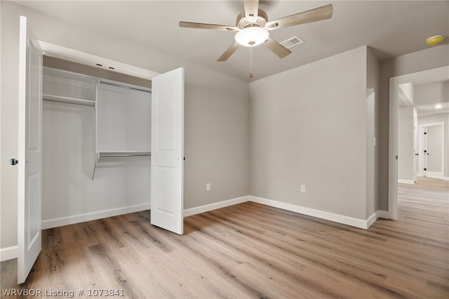 unfurnished bedroom with ceiling fan, a closet, and light hardwood / wood-style flooring