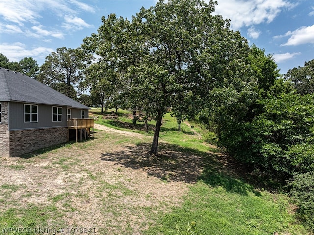 view of yard featuring a wooden deck