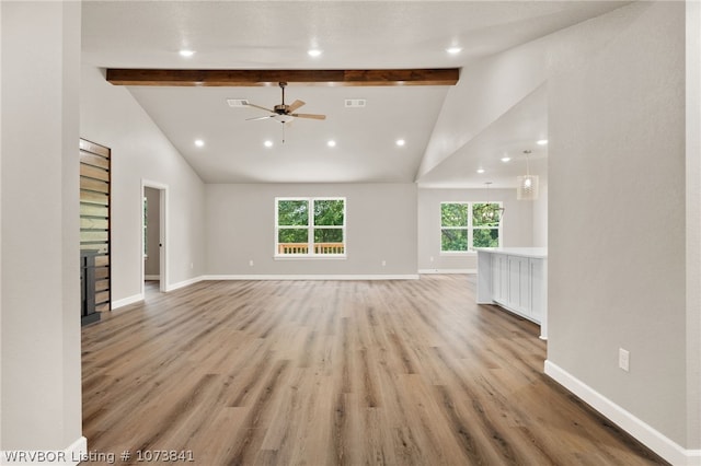 unfurnished living room featuring beamed ceiling, ceiling fan, high vaulted ceiling, and light hardwood / wood-style flooring