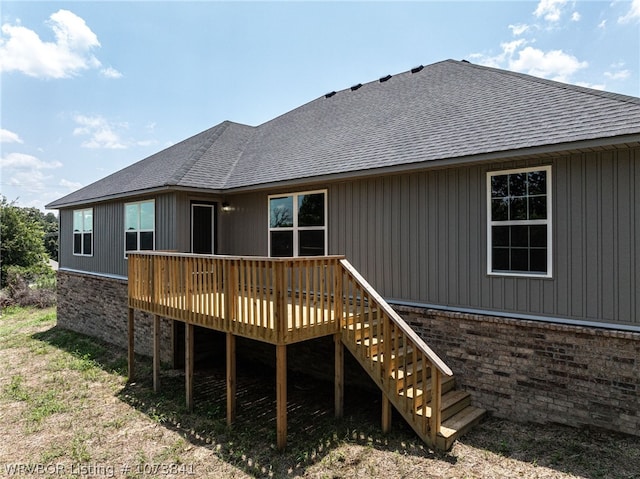 back of house with a wooden deck