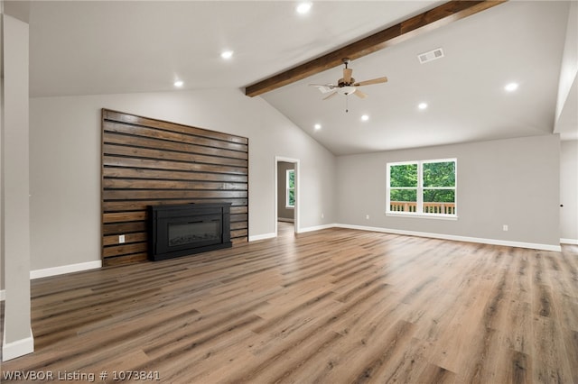 unfurnished living room with vaulted ceiling with beams, ceiling fan, and wood-type flooring