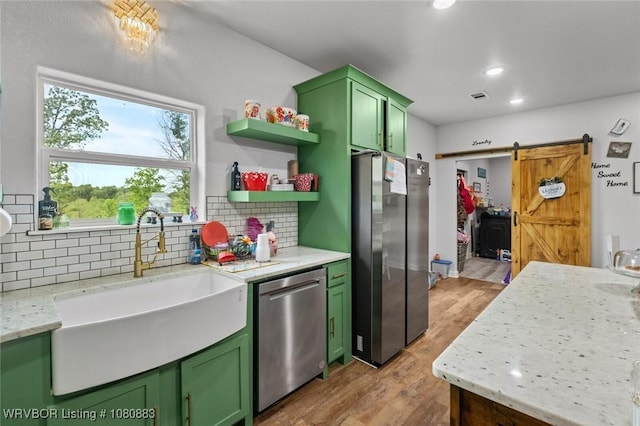 471962 E 720, Westville, OK 74965 - kitchen featuring green cabinetry, stainless steel appliances, a sink, light wood-style flooring, and recessed lighting