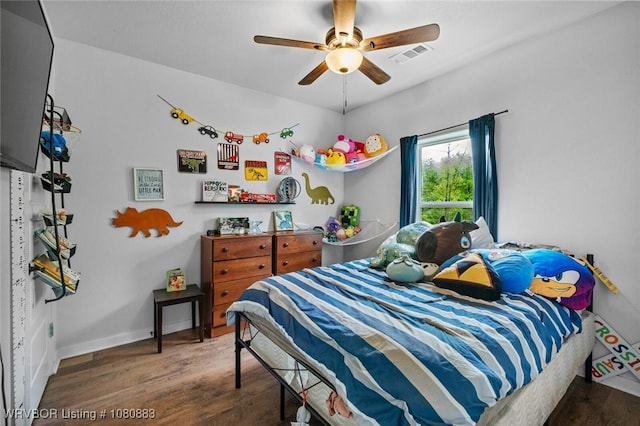 471962 E 720, Westville, OK 74965 - bedroom with wood finished floors, a ceiling fan, and baseboards