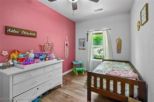 471962 E 720, Westville, OK 74965 - bedroom with wood finished floors, baseboards, and ceiling fan