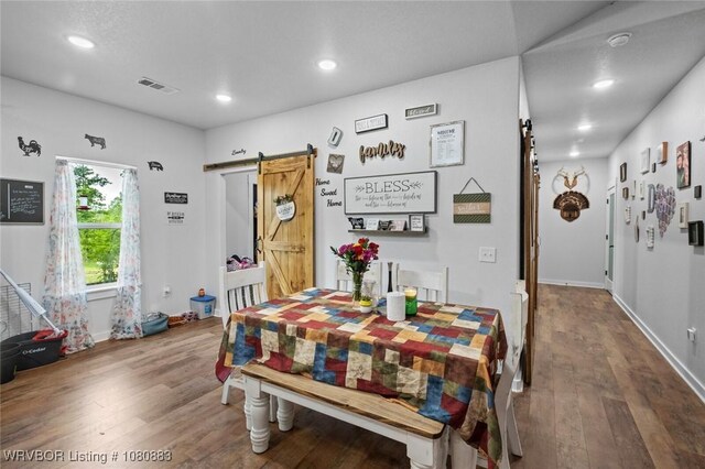 471962 E 720, Westville, OK 74965 - dining area featuring a barn door, wood finished floors, recessed lighting, and baseboards