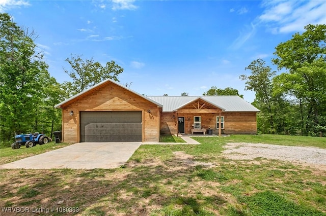 471962 E 720, Westville, OK 74965 - view of front facade featuring metal roof, a front lawn, an attached garage, and driveway