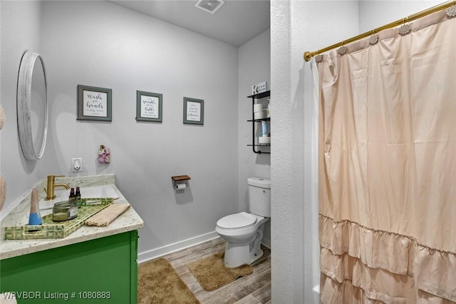 471962 E 720, Westville, OK 74965 - full bath with toilet, wood finished floors, vanity, and curtained shower