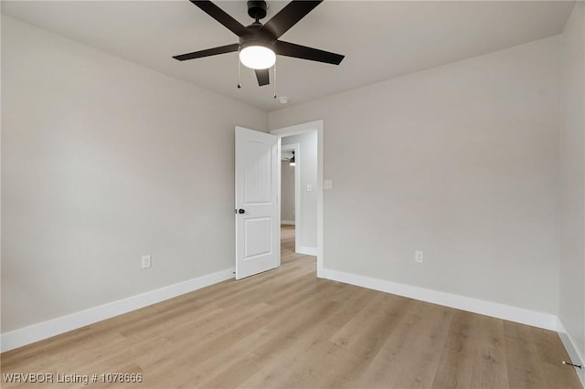 unfurnished room with ceiling fan and light hardwood / wood-style flooring