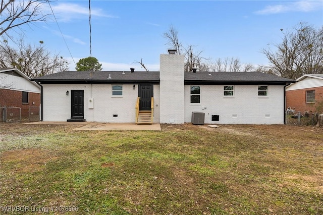 rear view of house with a yard, central AC, and a patio area