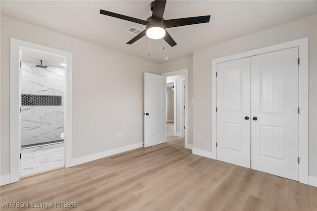 unfurnished bedroom with ceiling fan, a closet, connected bathroom, and light hardwood / wood-style flooring