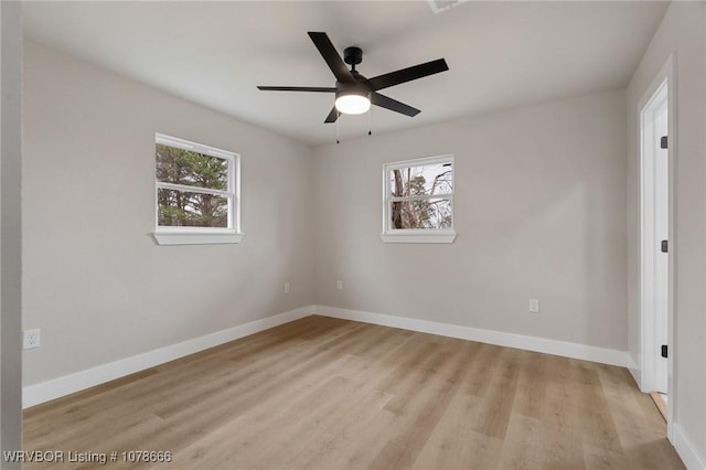 empty room with ceiling fan and light wood-type flooring