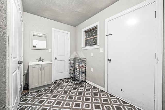 bathroom featuring vanity and a textured ceiling