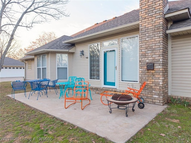 view of patio with an outdoor fire pit