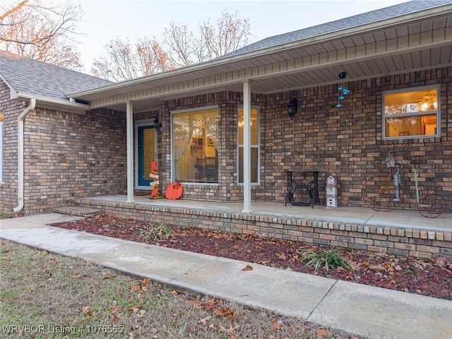 property entrance featuring covered porch