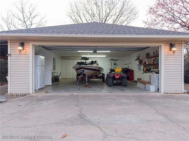 view of parking / parking lot with a garage