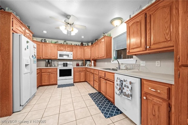 kitchen with light tile patterned floors, white appliances, ceiling fan, and sink