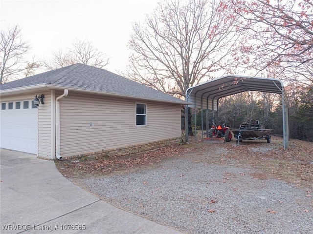 view of property exterior with a carport and a garage