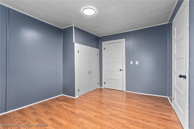 spare room featuring light wood-type flooring