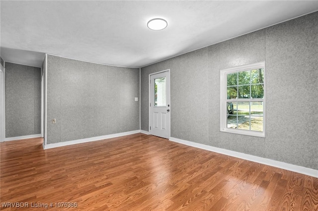 foyer entrance with hardwood / wood-style floors and plenty of natural light