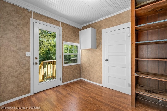 doorway to outside featuring crown molding and wood-type flooring