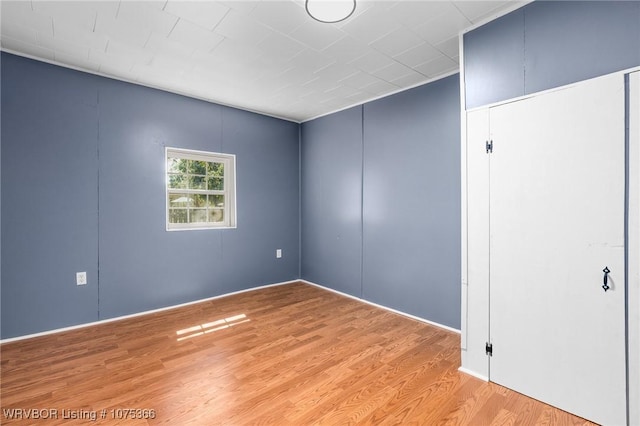 spare room featuring light wood-type flooring